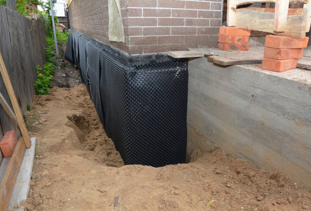 Happy homeowners after waterproofing job in River Edge